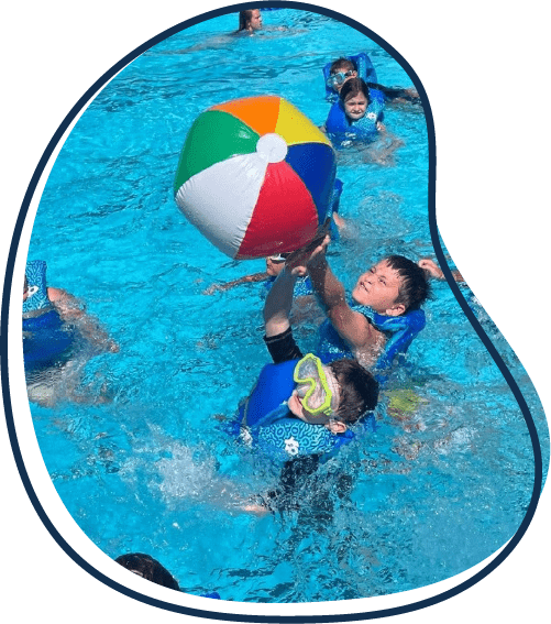 Children playing with beach ball in Jefferson City Pool