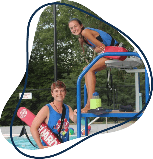 Two lifeguards smile for the camera at a JC Pool. 