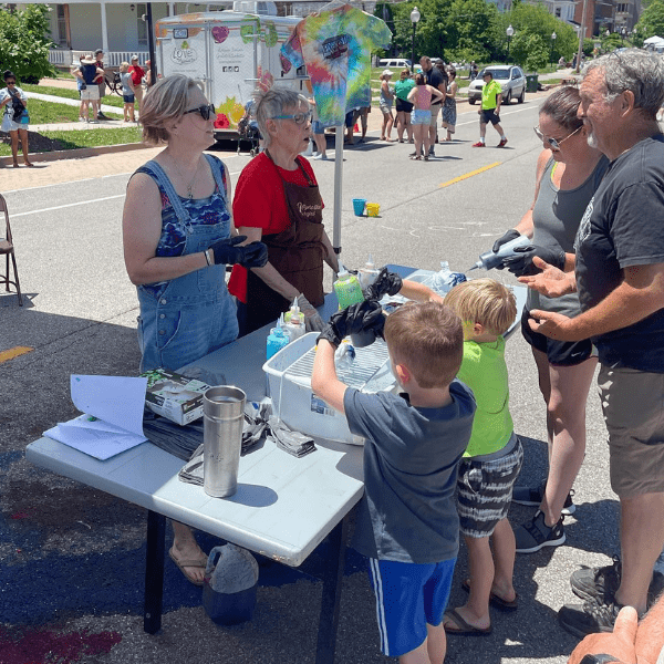 Family at an art booth at JC PorchFest