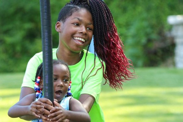 Sisters playing at Community Park